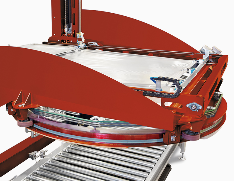 Wrapping machine with an integrated overlay film applicator - PKG THE RING