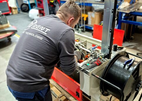 A mechanic is repairing a machine.